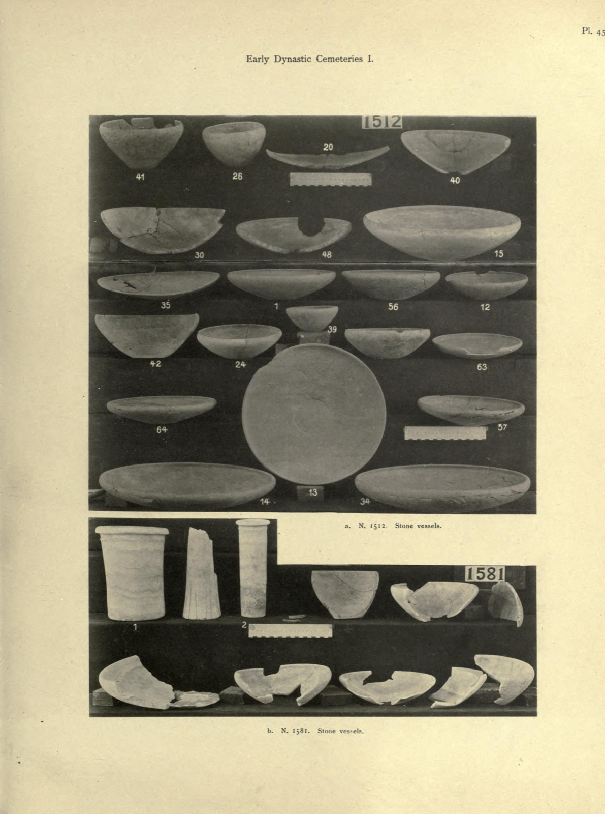 A plate of stone vessels on stepped shelves, with graduated scale strips at two levels