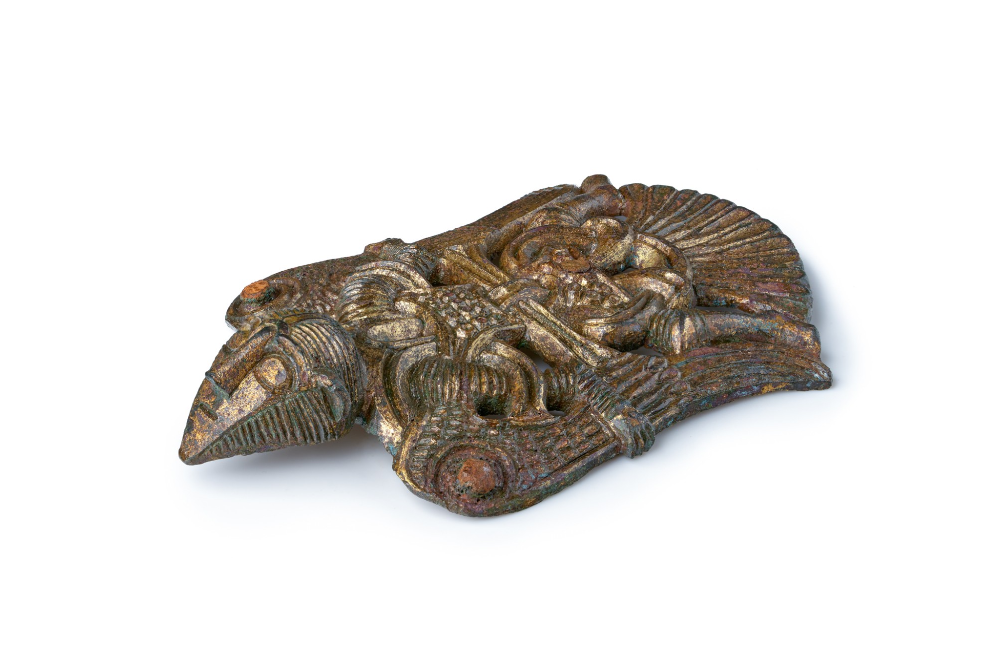 A gilded mount on white, photographed at an angle